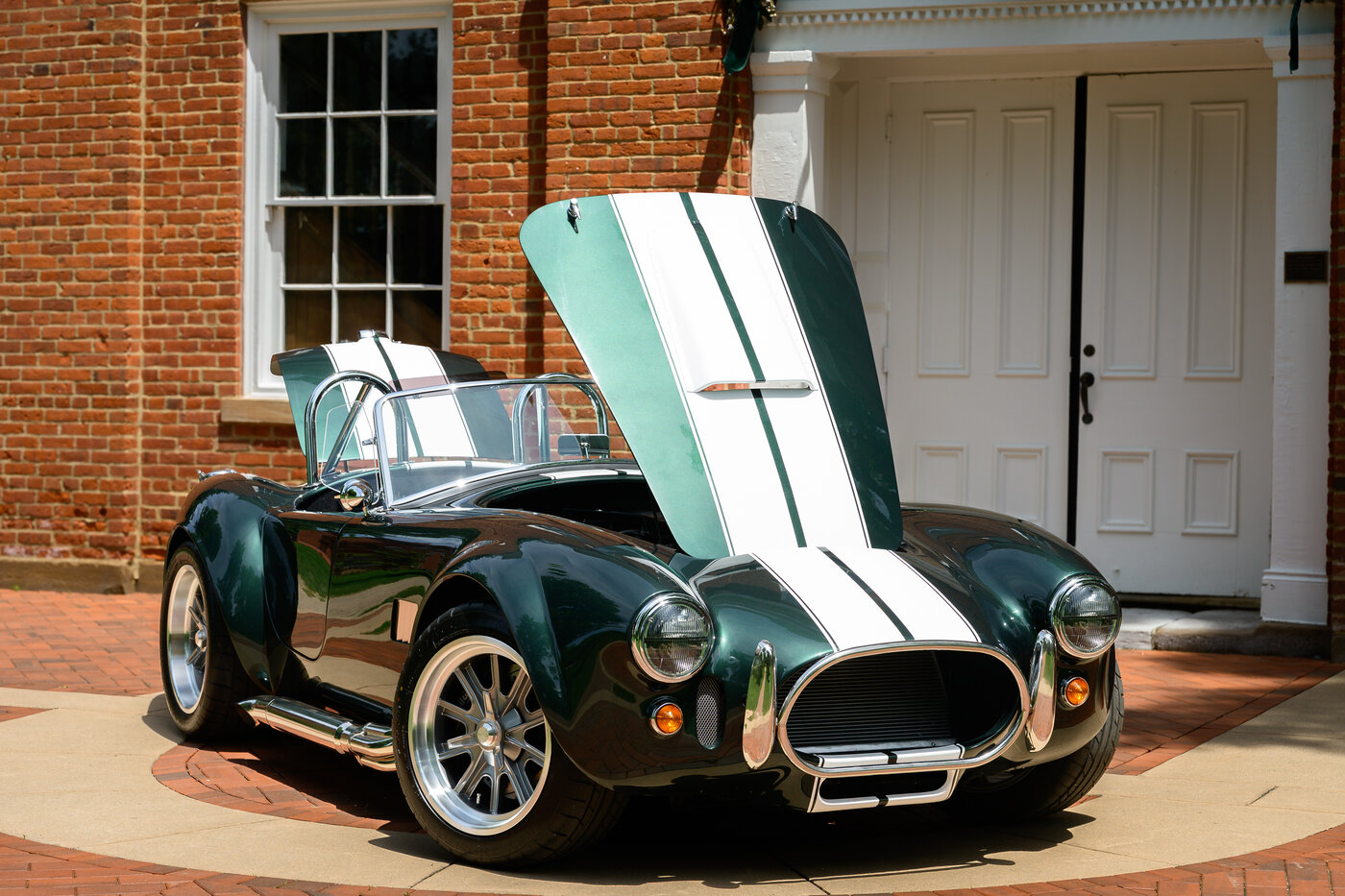Factory Five Mk5 Cobra — front 3/4 view on brick driveway