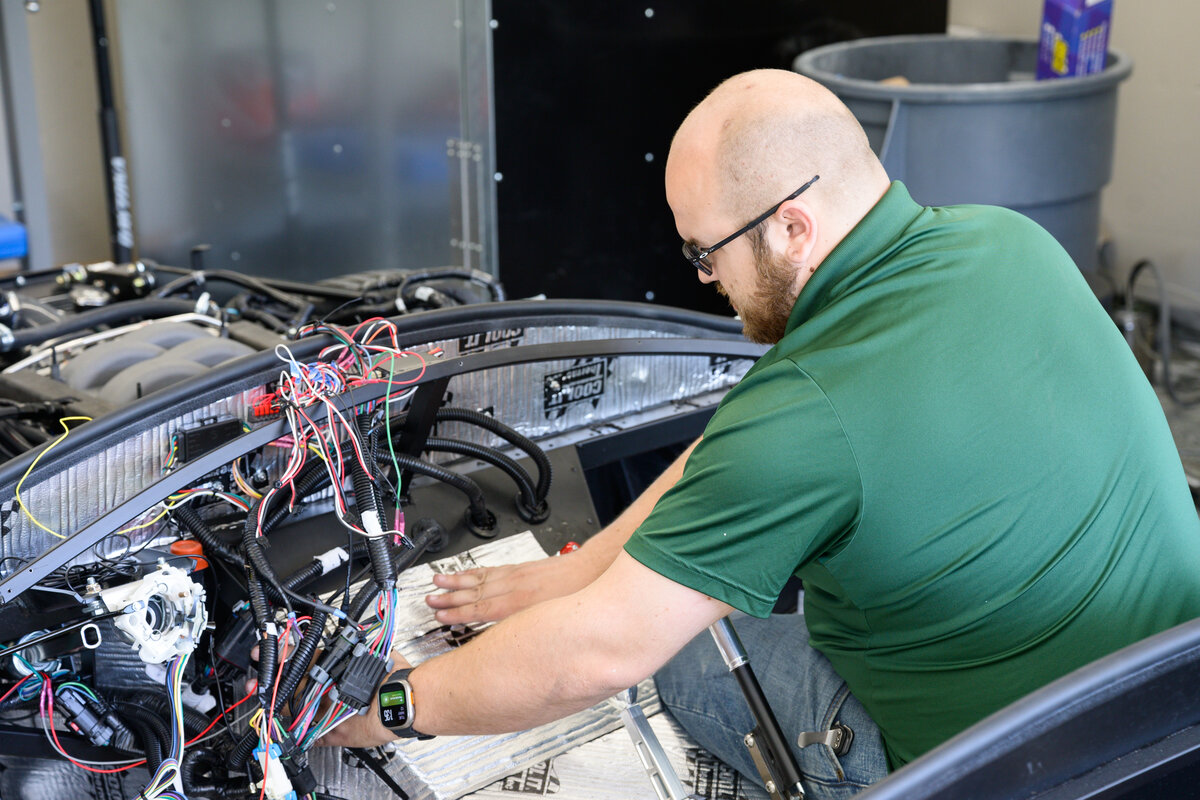 Hands-on wiring work during the Mk5 Cobra build